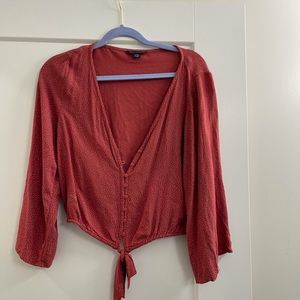 Red blouse slightly cropped